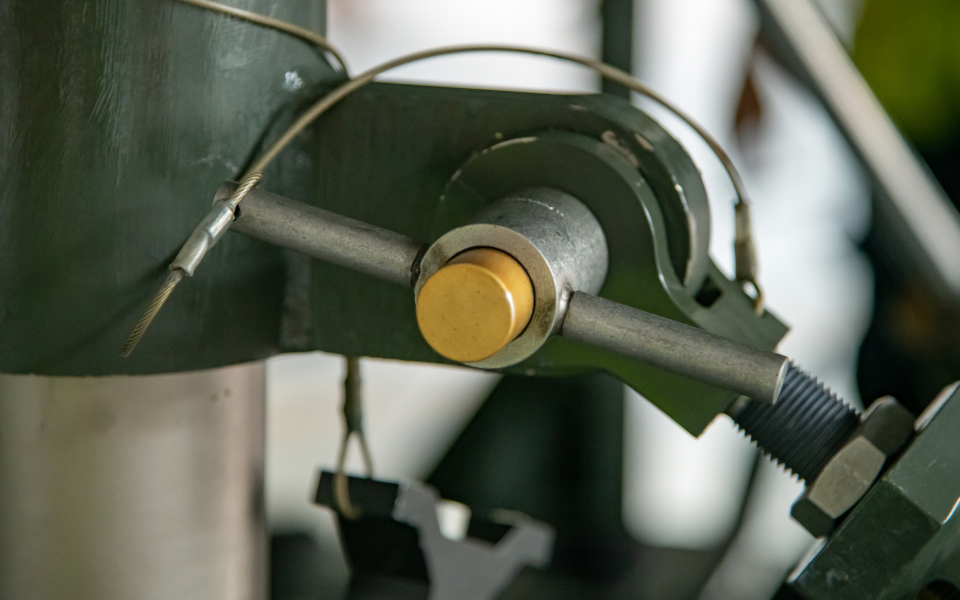 Industrial machine part with a metal rod