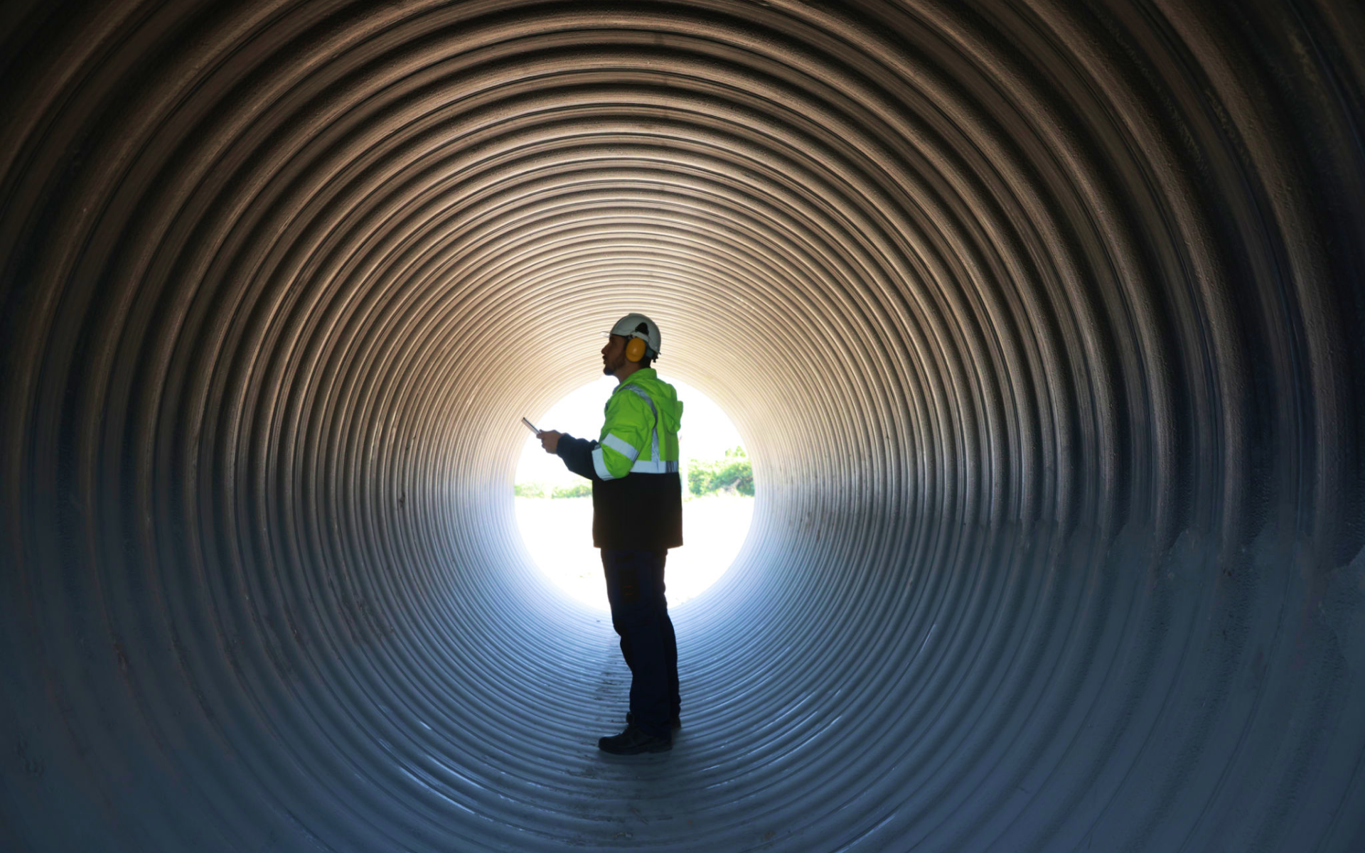 Person in safety gear inside tunnel
